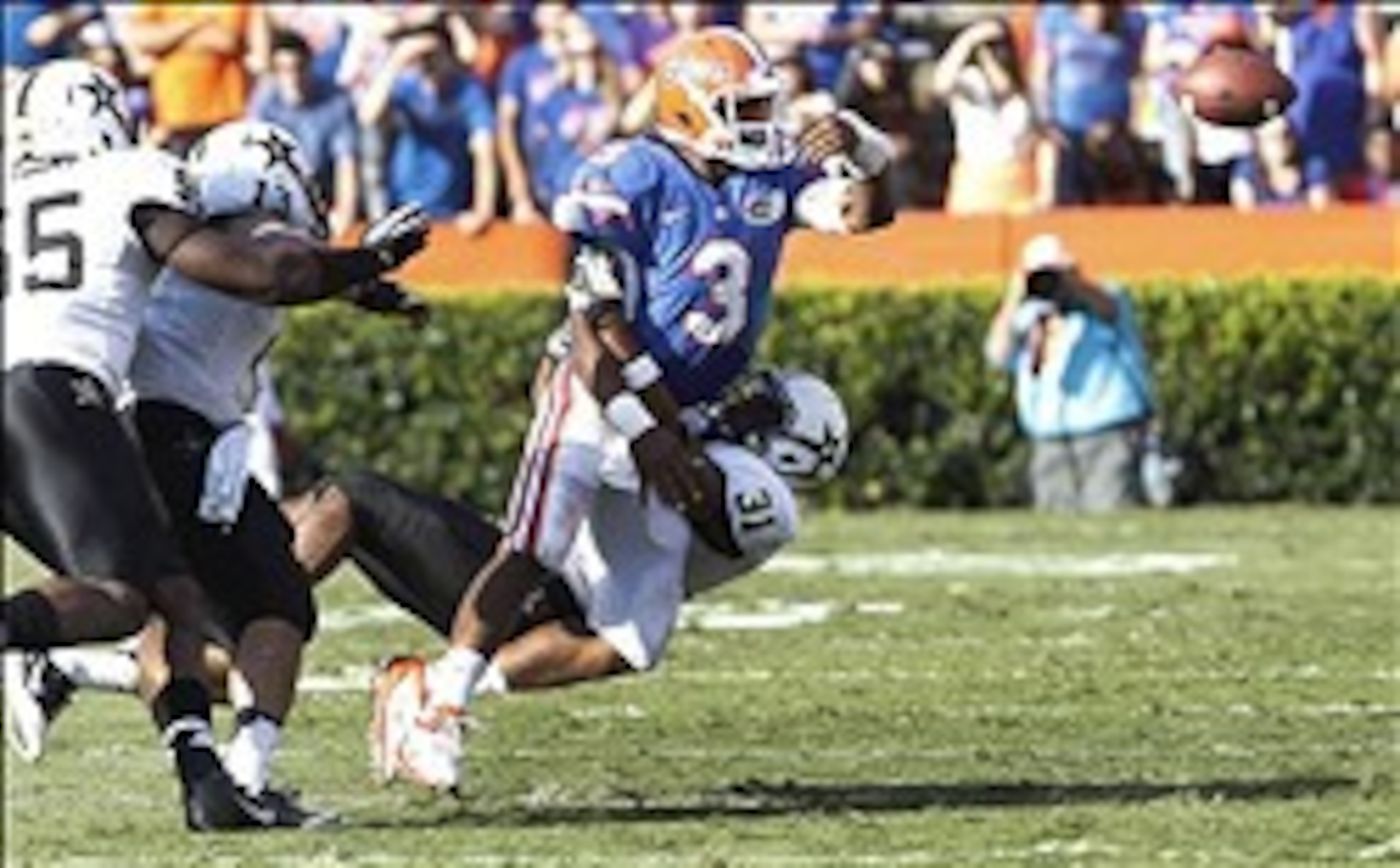 Nov 9, 2013; Gainesville, FL, USA; Florida Gators quarterback Tyler Murphy (3) is called for intentional grounding as Vanderbilt Commodores safety Javon Marshall (31) tackles him during the second half at Ben Hill Griffin Stadium. Vanderbilt Commodores de