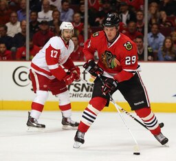 Bryan Bickell skates with the puck against the Detroit Red Wings.