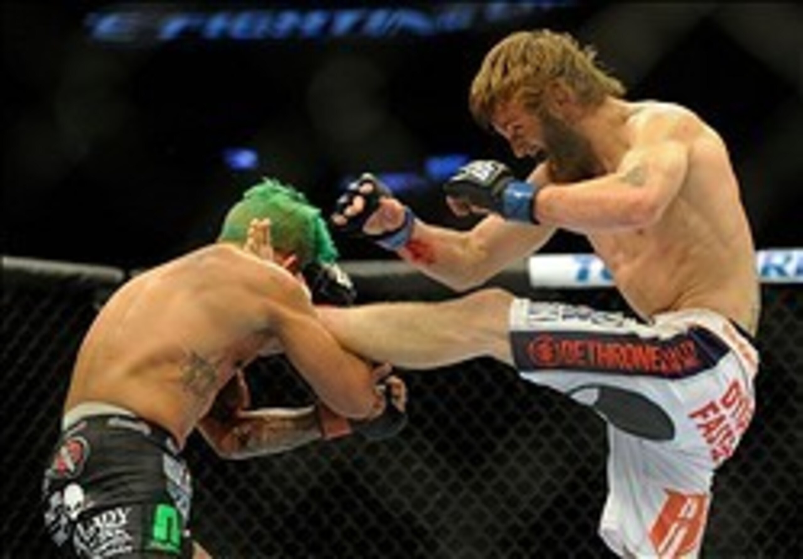 Tim Elliott (right) in a fight with Louis Gaudinot at UFC 164. Tim Elliott (right) in a fight with Louis Gaudinot at UFC 164.