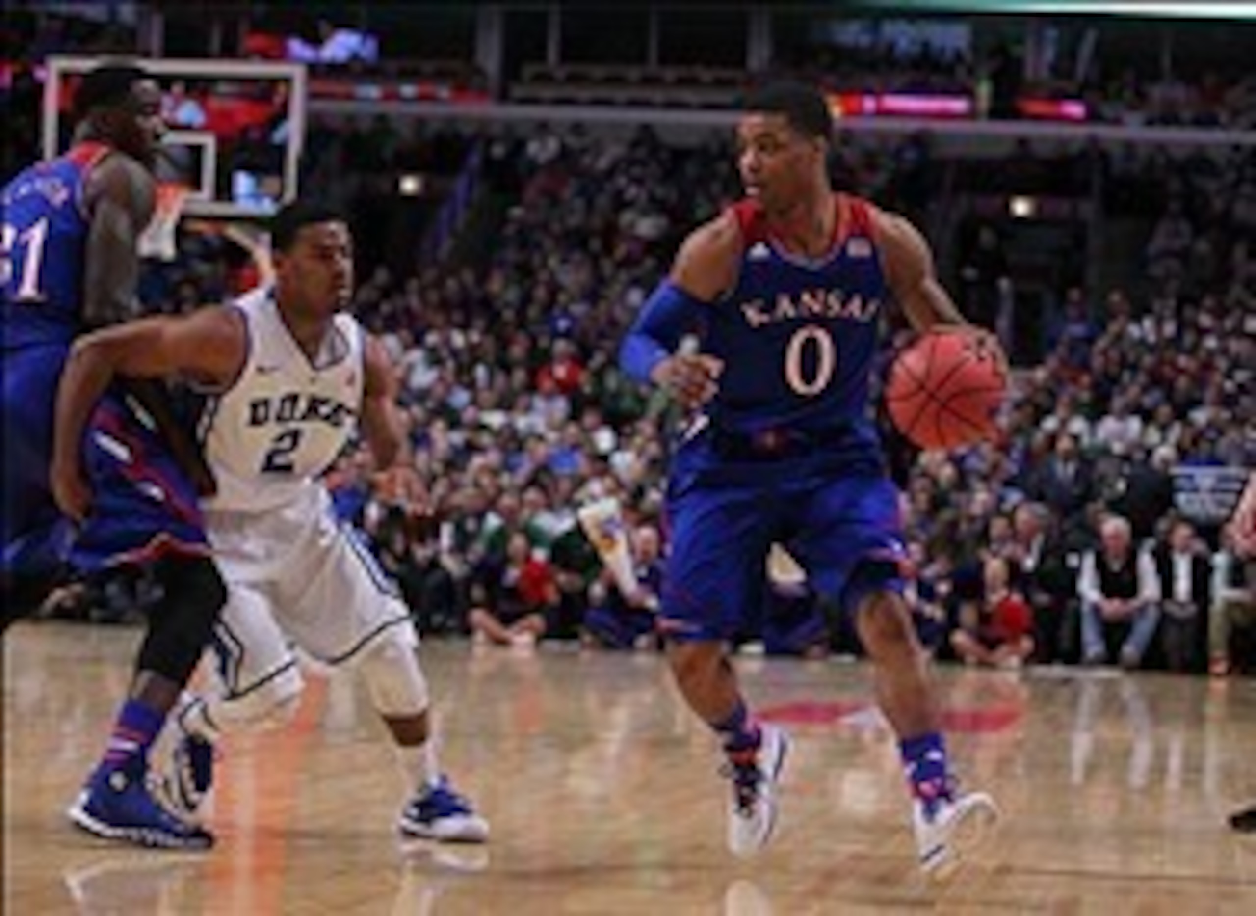 Nov 12, 2013; Chicago, IL, USA; Kansas Jayhawks guard Frank Mason (0) drives around Duke Blue Devils guard Quinn Cook (2) in the first half at United Center. Mandatory Credit: Dennis Wierzbicki-USA TODAY Sports