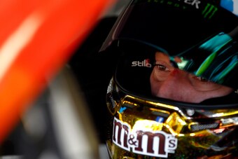 LOUDON, NH - SEPTEMBER 20:  Kyle Busch, driver of the #18 M&M's Peanut Butter Toyota, sits in his car during practice for the NASCAR Sprint Cup Series Sylvania 300 at New Hampshire Motor Speedway on September 20, 2013 in Loudon, New Hampshire.  (Photo by 