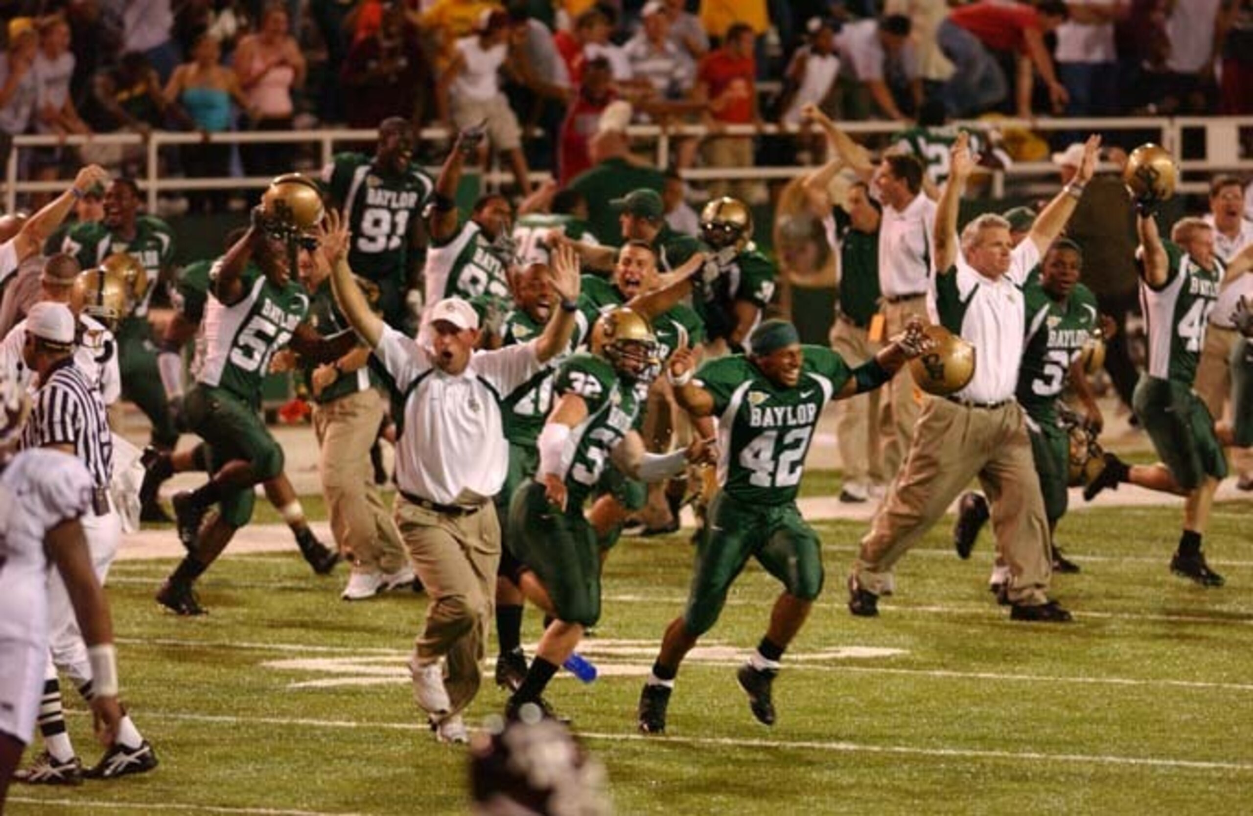 Baylor's sideline and bleachers spilled onto the field following its 35-34 overtime win over Texas A&M in 2004.