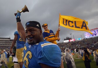 PASADENA, CA - NOVEMBER 17:  Defensive end Datone Jones #56 of the UCLA Bruins celebrates his teams 38-28 victory over the USC Trojans at the Rose Bowl on November 17, 2012 in Pasadena, California.  (Photo by Jeff Gross/Getty Images)