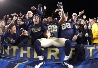 Pitt tight end Manasseh Garner celebrates with fans after a November upset of No. 23 Notre Dame.