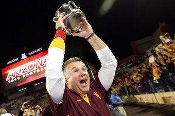 TUCSON, AZ - NOVEMBER 23:  Head coach Todd Graham of the Arizona State Sun Devils celebrates with the Territorial Cup after defeating the Arizona Wildcats 41-34 in the college football game at Arizona Stadium on November 23, 2012 in Tucson, Arizona.  (Pho
