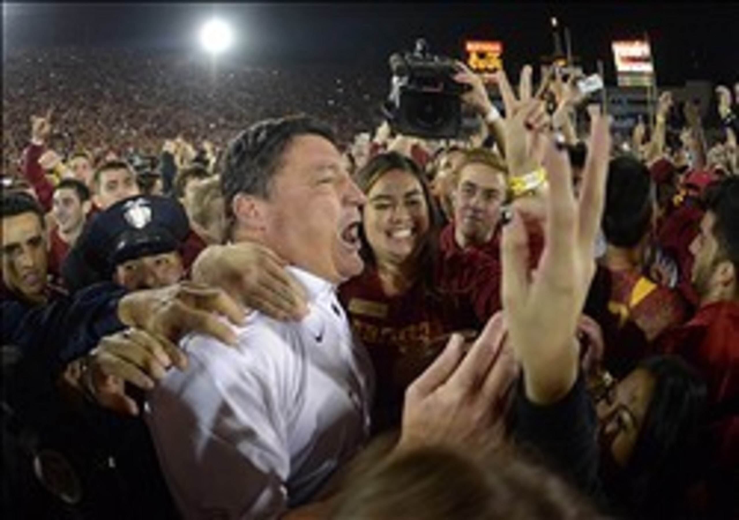 Ed Orgeron surrounded by thousands of USC fans when the Trojans upset then-No. 4 Stanford, 20-17.