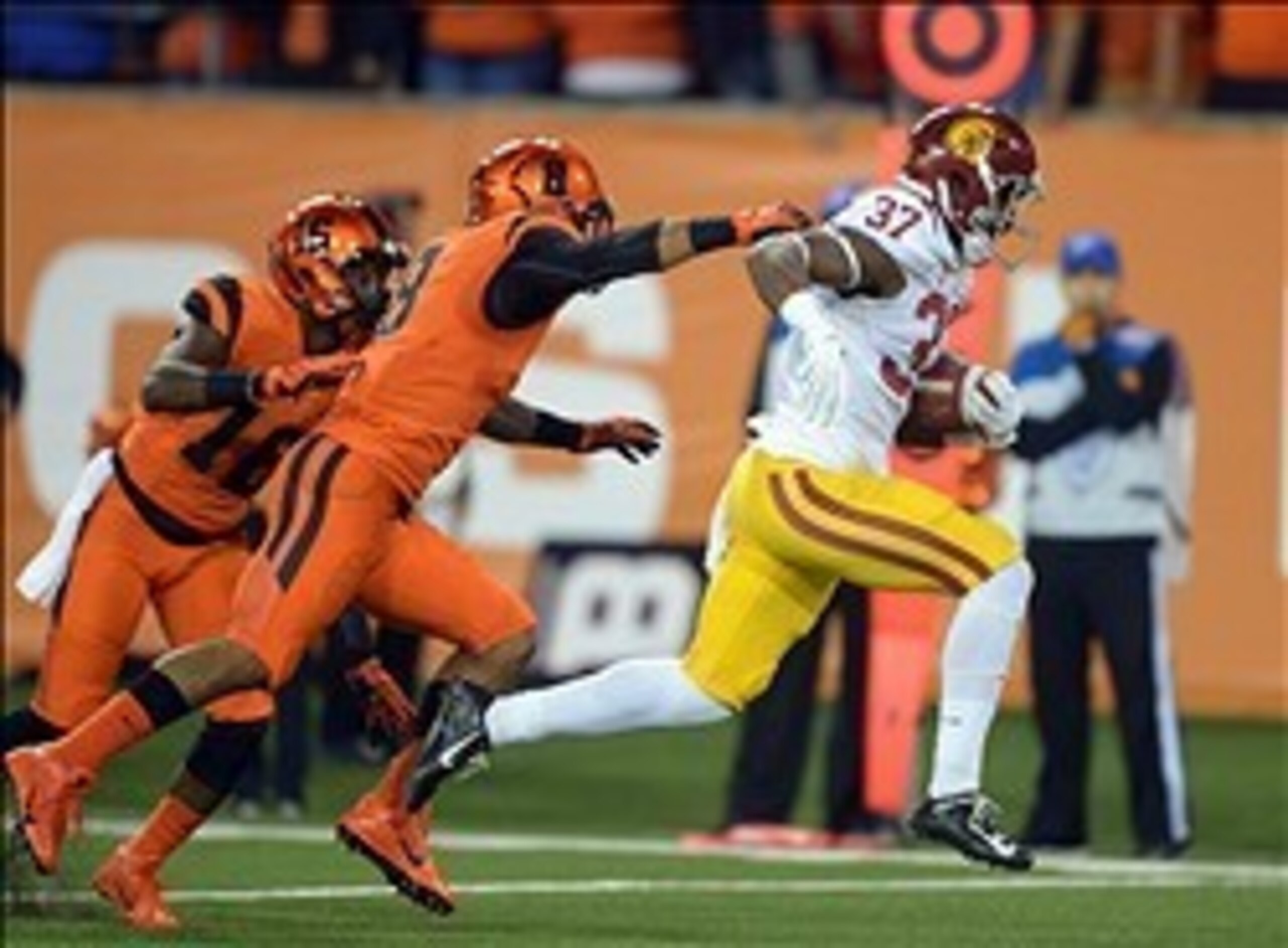Nov 1, 2013; Corvallis, OR, USA; Southern California Trojans tailback Javorious Allen (37) is pursued by Oregon State Beavers safety Tyrequek Zimmerman (8) and cornerback Larry Scott (15) on an 18-yard touchdown run in the second quarter against the Orego