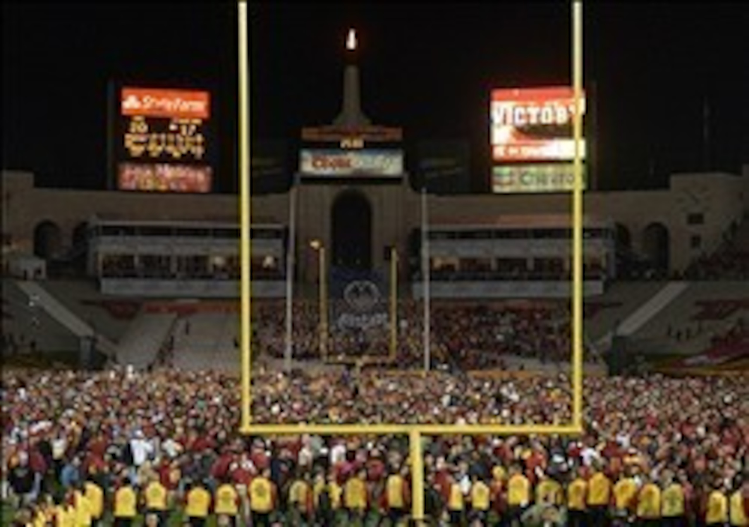 USC fans rushed the field after the Trojans' upset over the Cardinal.