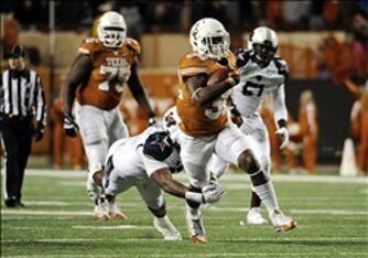 True freshman Kent Perkins helped Texas amass 281 rushing yards on Thanksgiving.