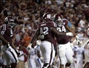 Kirby Ennis embraces Damontre Moore during the 2012 game against South Carolina State.