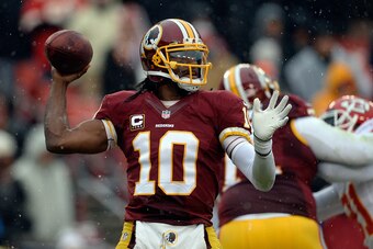 LANDOVER, MD - DECEMBER 08:  Quarterback Robert Griffin III #10 of the Washington Redskins throws a pass in the first half during an NFL game against the Kansas City Chiefs at FedExField on December 8, 2013 in Landover, Maryland.  (Photo by Patrick McDerm