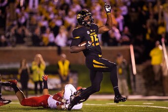 Mizzou's Dorial Green-Beckham eludes an Arkansas State defender en route to a touchdown.