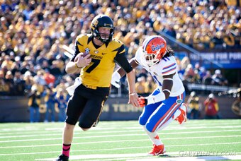 Mizzou freshman quarterback Maty Mauk runs from the Florida defense.