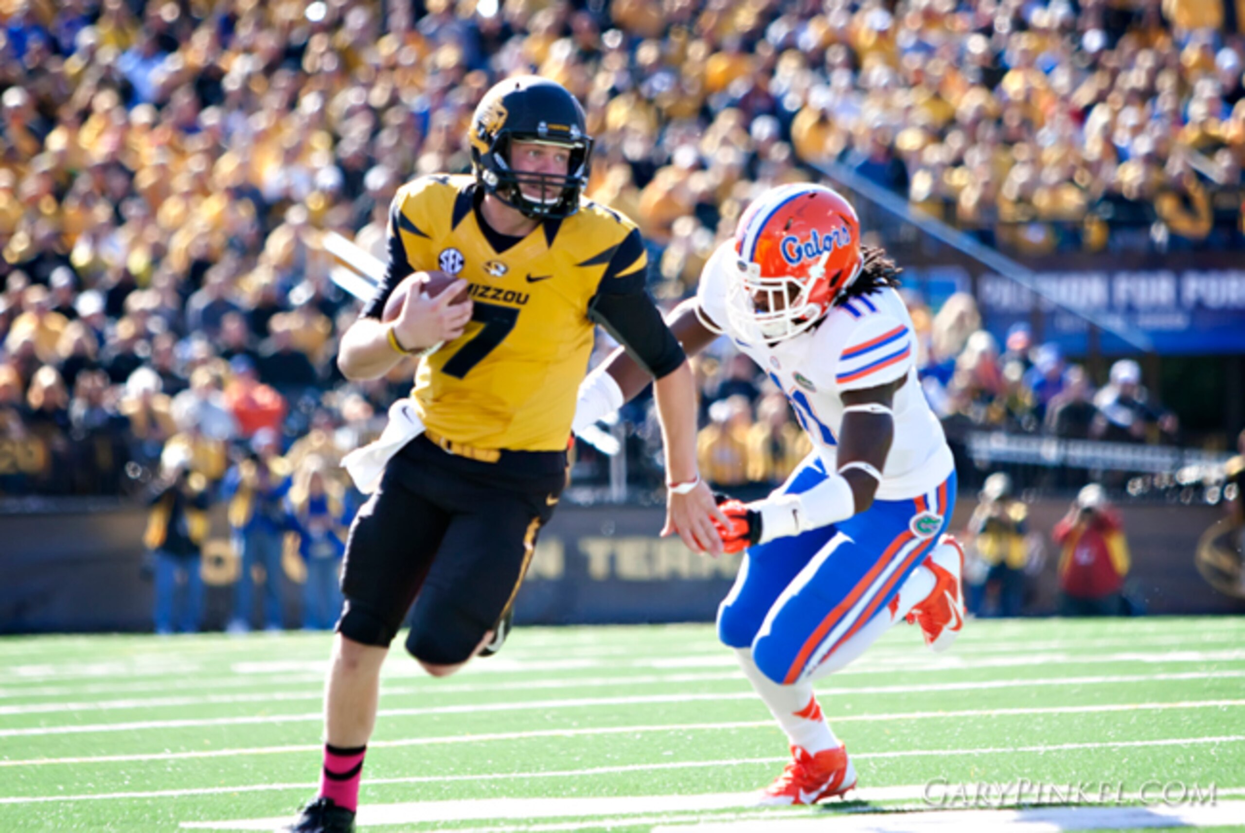 Mizzou freshman quarterback Maty Mauk runs from the Florida defense.