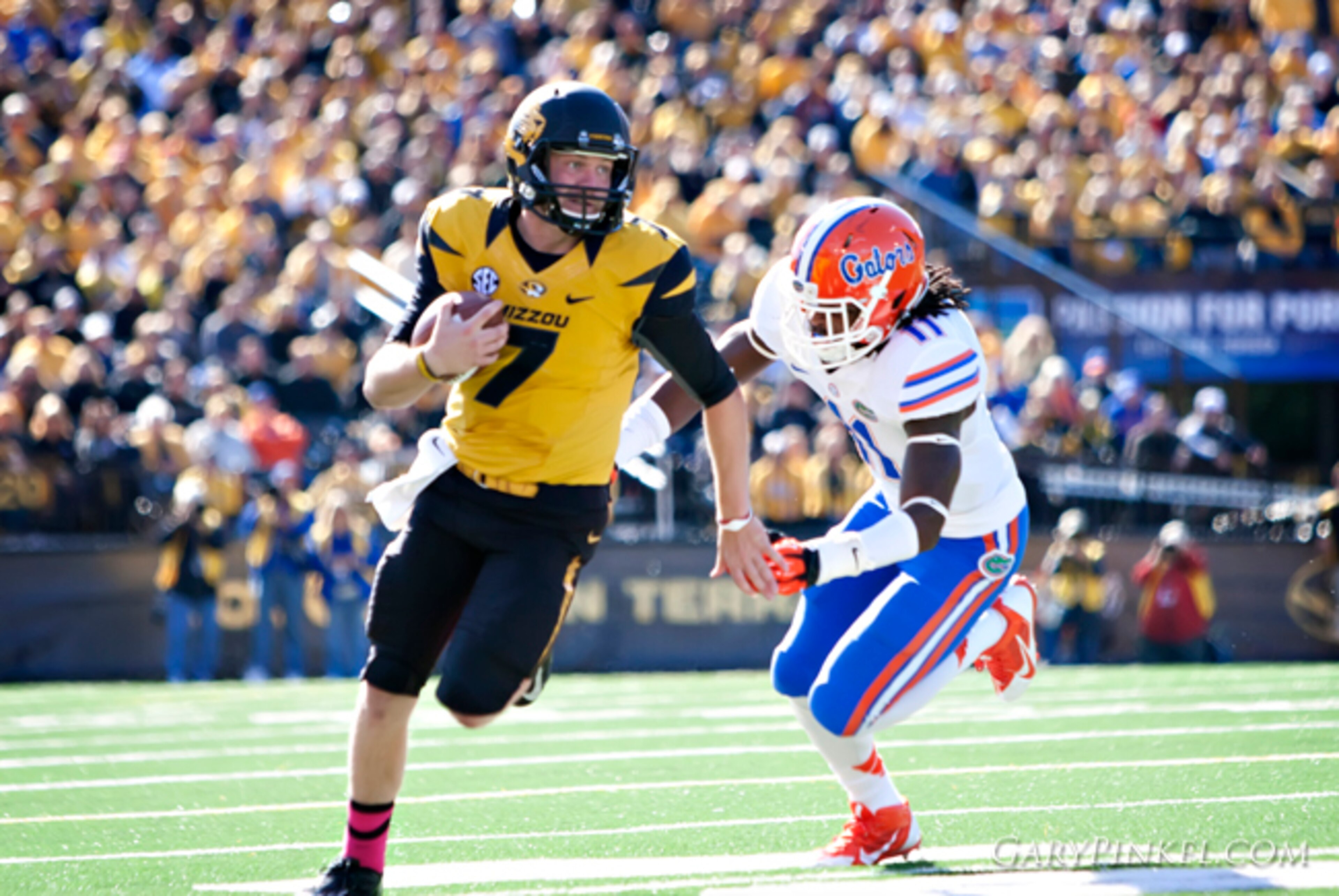 Mizzou freshman quarterback Maty Mauk runs from the Florida defense.
