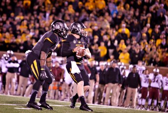 Running back Marcus Murphy and quarterback Maty Mauk try to move the ball downfield against South Carolina late in the game.