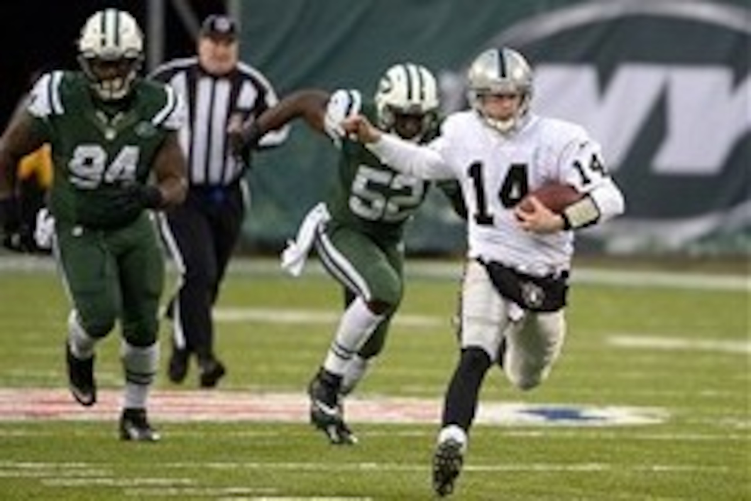 Dec 8, 2013; East Rutherford, NJ, USA; Oakland Raiders quarterback Matt McGloin (14) scrambles from New York Jets defensive lineman Damon Harrison (94) and linebacker David Harris (52) at MetLife Stadium. The Jets defeated the Raiders 37-27 Mandatory Cred Dec 8, 2013; East Rutherford, NJ, USA; Oakland Raiders quarterback Matt McGloin (14) scrambles from New York Jets defensive lineman Damon Harrison (94) and linebacker David Harris (52) at MetLife Stadium. The Jets defeated the Raiders 37-27 Mandatory Cred