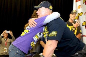 John Cena hugs a fan at a recent PR event.