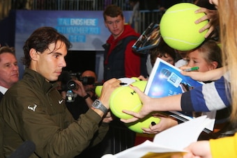 Rafael Nadal signs autographs in London at ATP World Finals.