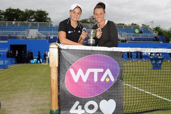 Ashleigh Barty and Casey Dellacqua of Australia pose at the Aegon Classic in 2013.