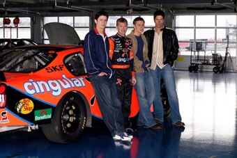 Burton (second from left) poses with the cast from