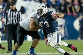 Oct 25, 2013; Provo, UT, USA; Brigham Young Cougars linebacker Kyle Van Noy (3) attempts to rush around the block of Boise State Broncos offensive linesman Travis Averill (73) during the second half at Lavell Edwards Stadium. Brigham Young won 37-20. Mand