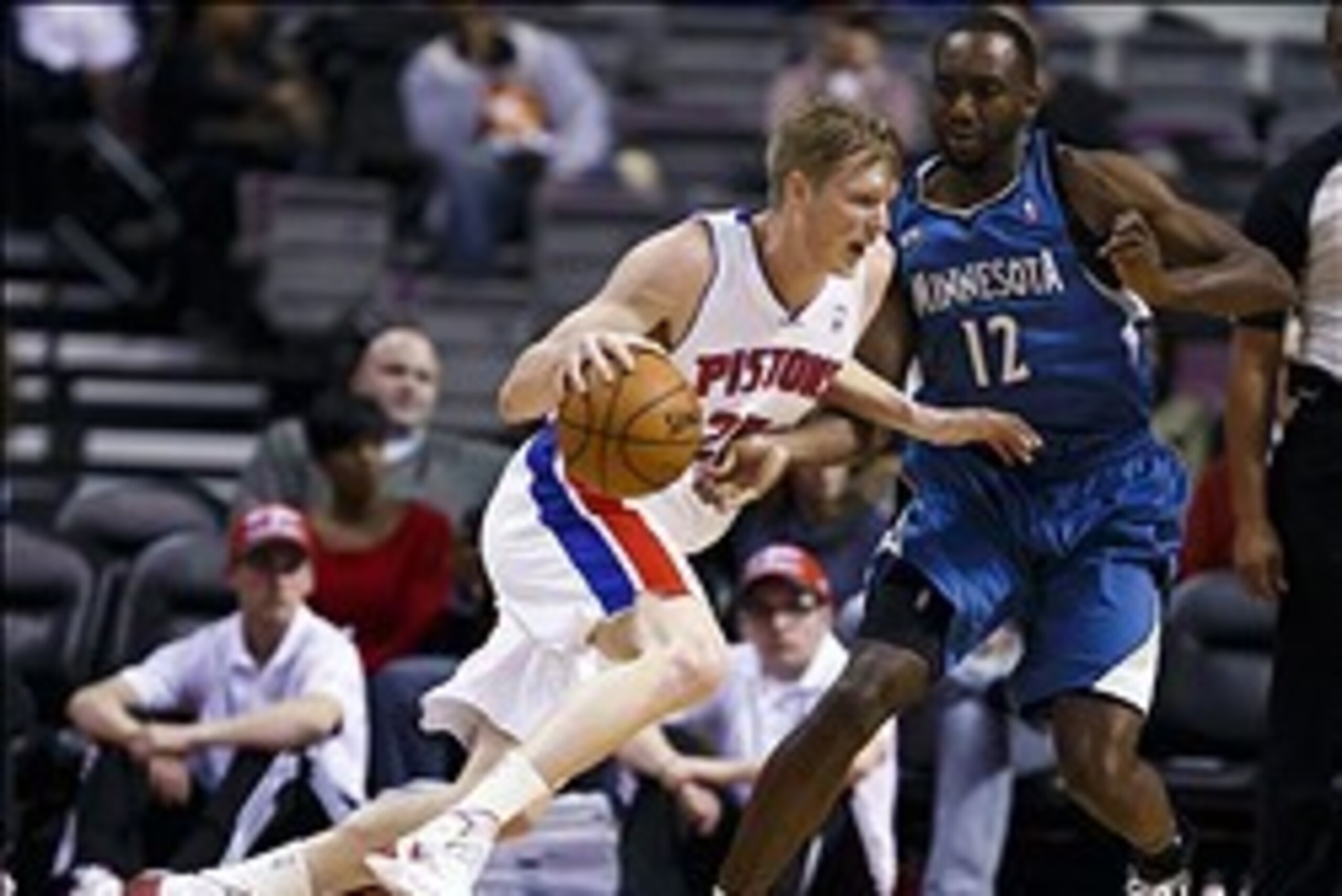 Dec 10, 2013; Auburn Hills, MI, USA; Detroit Pistons small forward Kyle Singler (25) is defended by Minnesota Timberwolves power forward Luc Richard Mbah a Moute (12) in the first quarter at The Palace of Auburn Hills. Mandatory Credit: Rick Osentoski-USA