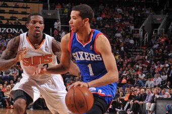PHOENIX, AZ - DECEMBER 28: Michael Carter-Williams #1 of the Philadelphia 76ers drives against Eric Bledsoe #2 of the Phoenix Suns on December 28, 2013 at U.S. Airways Center in Phoenix, Arizona. NOTE TO USER: User expressly acknowledges and agrees that, 