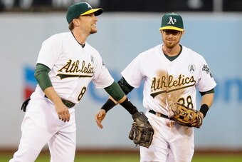 Jed Lowrie (left) and Eric Sogard thought they'd be utility and both earned starting jobs. One keeps his, the other falls back to platoon.