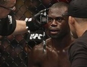 Hall stares across the Octagon between rounds during his bout with Howard.