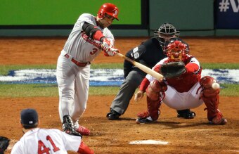 BOSTON, MA - OCTOBER 30:  Carlos Beltran #3 of the St. Louis Cardinals hits a RBI single in the seventh inning off pitcher John Lackey #41 of the Boston Red Sox during Game Six of the 2013 World Series at Fenway Park on October 30, 2013 in Boston, Massach