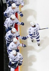 WINNIPEG, MB - JANUARY 7: Ondrej Palat #18 of the Tampa Bay Lightning celebrates his second period goal against the Winnipeg Jets with teammates at the bench at the MTS Centre on January 7, 2014 in Winnipeg, Manitoba, Canada. (Photo by Jonathan Kozub/NHLI