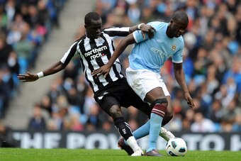 MANCHESTER, ENGLAND - OCTOBER 03:  Yaya Toure of Manchester City battles with Cheik Tiote of Newcastle United during the Barclays Premier League match between Manchester City and Newcastle United at City of Manchester Stadium on October 3, 2010 in Manches