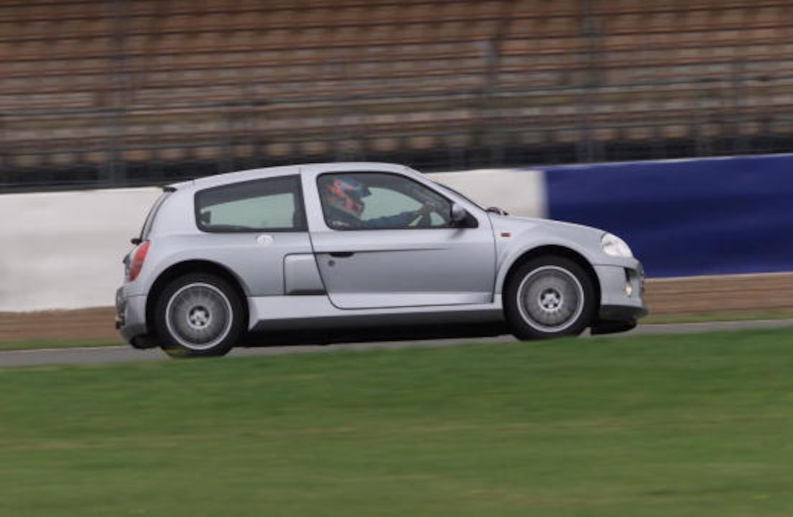 A V6 Renault being driven by an F1 driver.