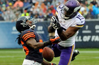 CHICAGO, IL - SEPTEMBER 15: Tim Jennings #26 of the Chicago Bears breaks up a pass to Greg Jennings #15 of the Minnesota Vikings during the first half on September 15, 2013 at Soldier Field in Chicago, Illinois. (Photo by David Banks/Getty Images)