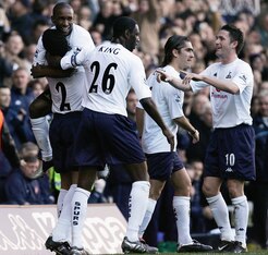 Defoe congratulates Naybet on a day when both scored in a memorable North London derby.