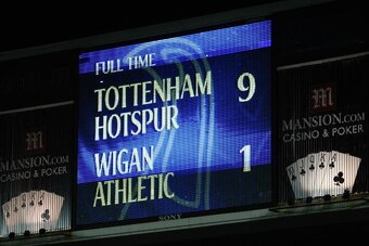Defoe scored five as Spurs thrashed Wigan.