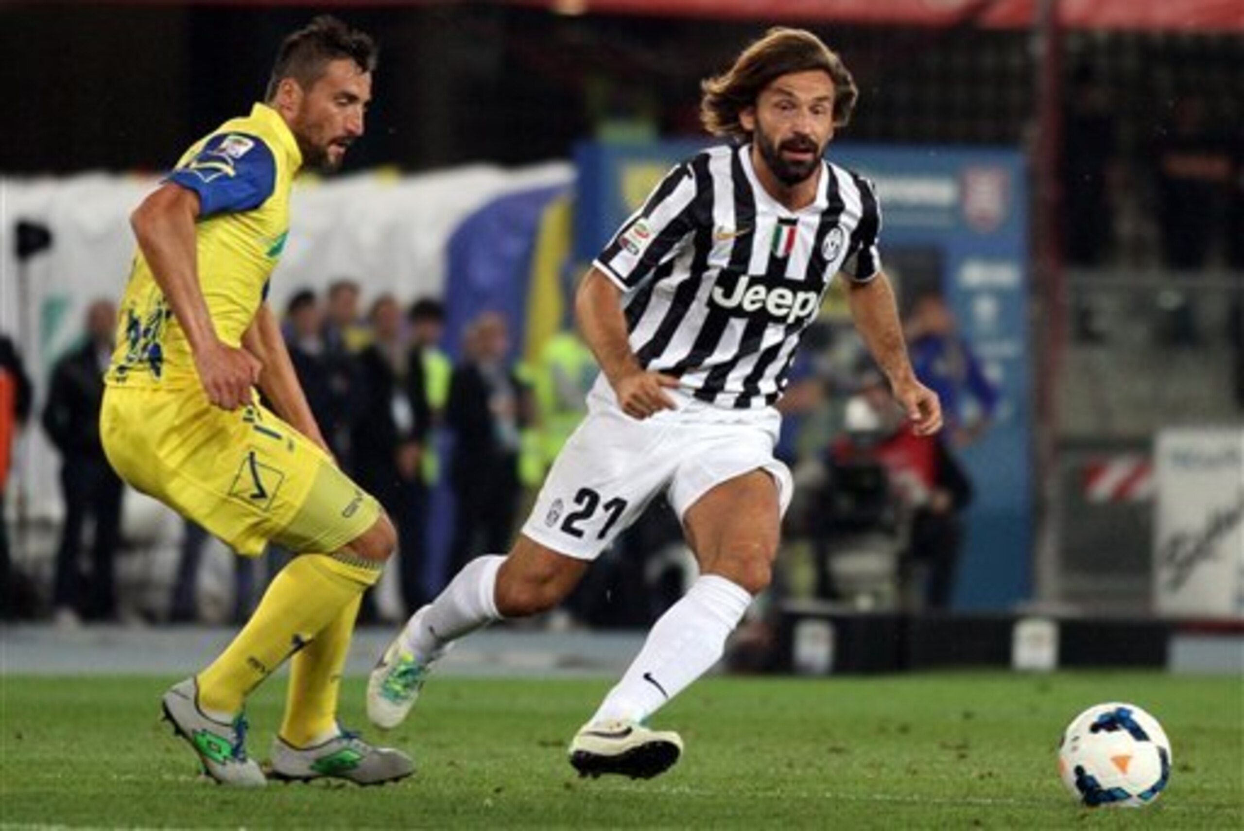 Andrea Pirlo searches for a teammate against Chievo.