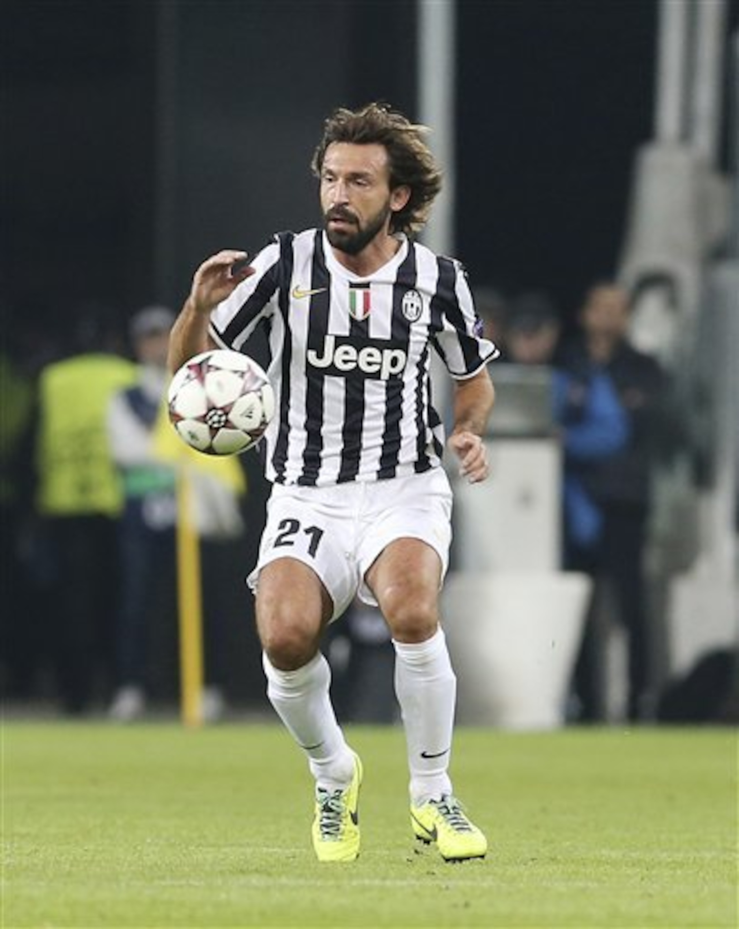 Andrea Pirlo plays the ball in the Champions League.