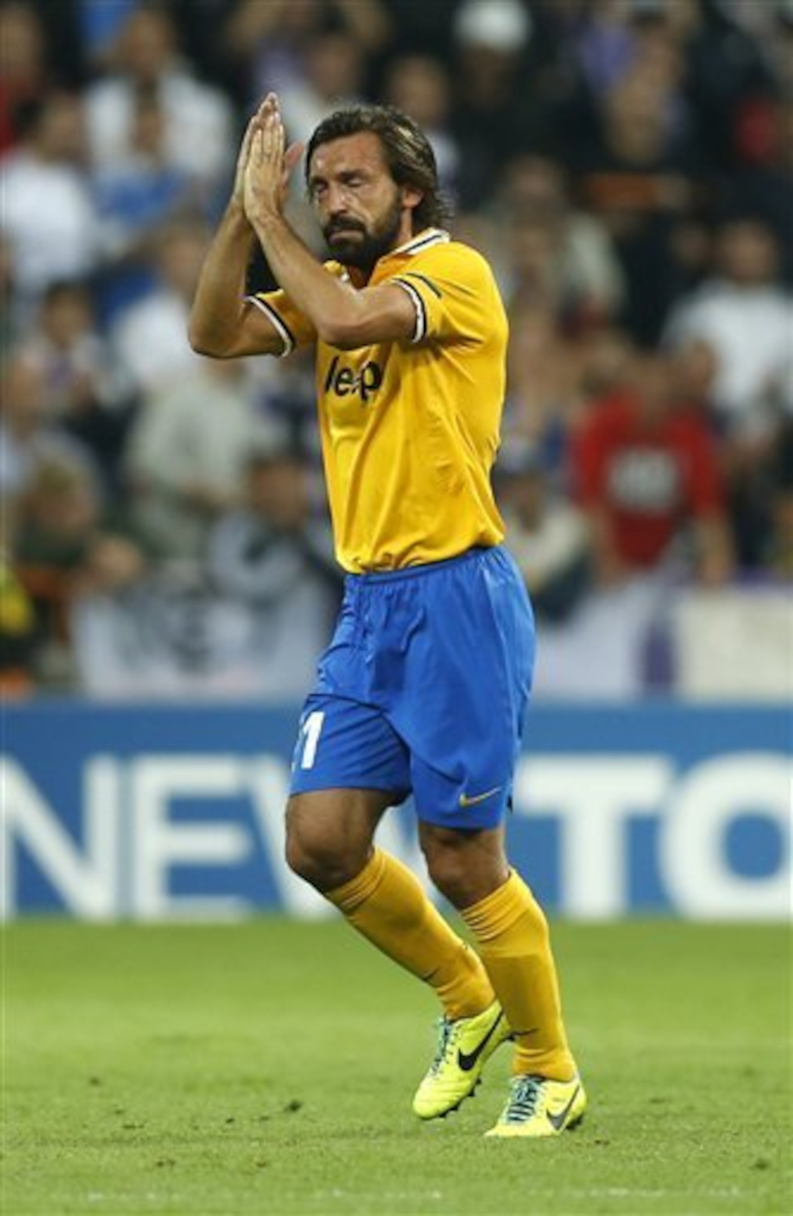 Andrea Pirlo salutes Juve's fans after being substituted at Real Madrid in the Champions League.