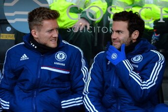Juan Mata warming the bench