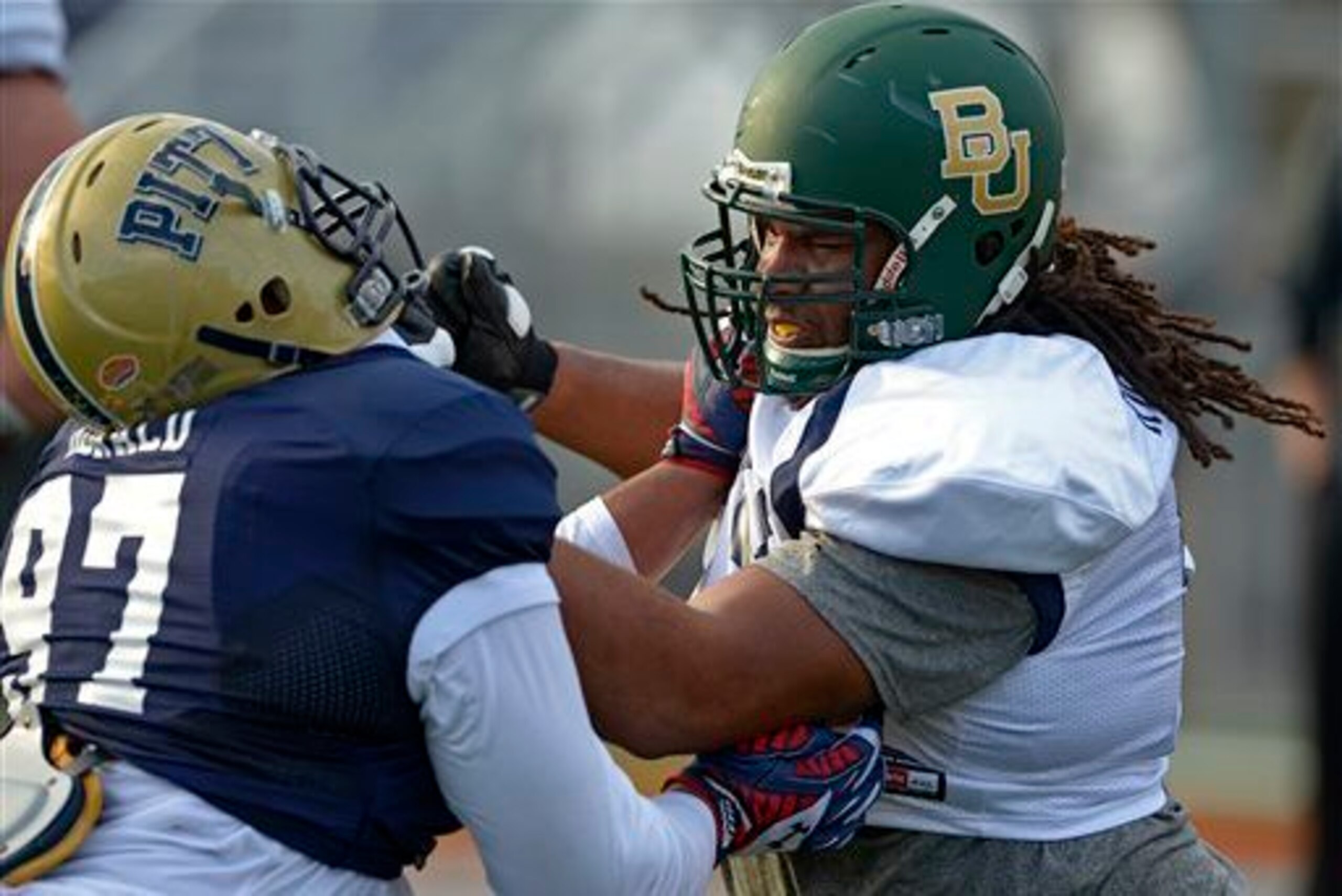 Pitt's Aaron Donald fighting it out with Baylor's Cyril Richardson during Senior Bowl Practice: Both players could help Miami