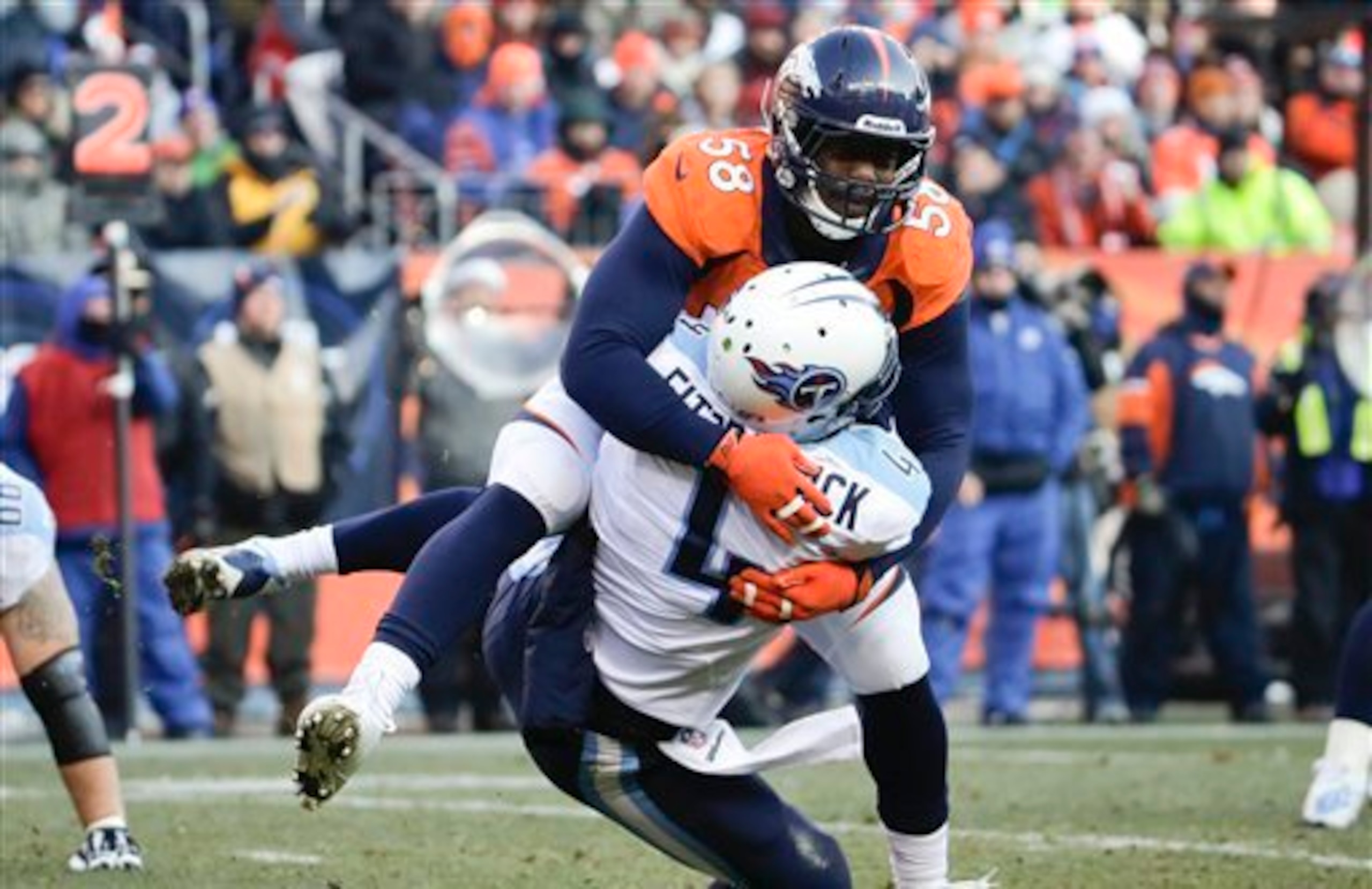 Von Miller makes a tackle against Tennessee