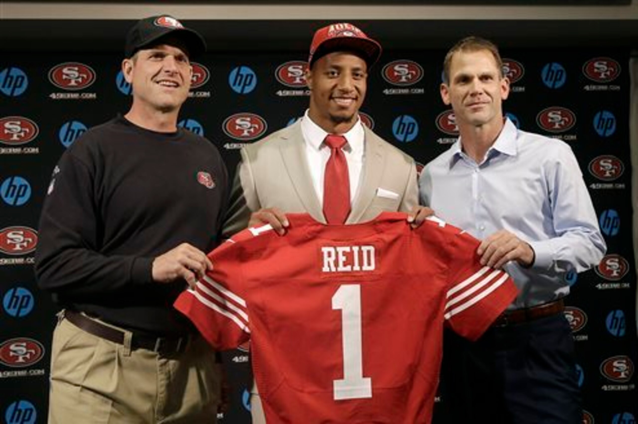 Jim Harbaugh and Trent Baalke with Eric Reid the 49ers' 2013  first-round draft pick.