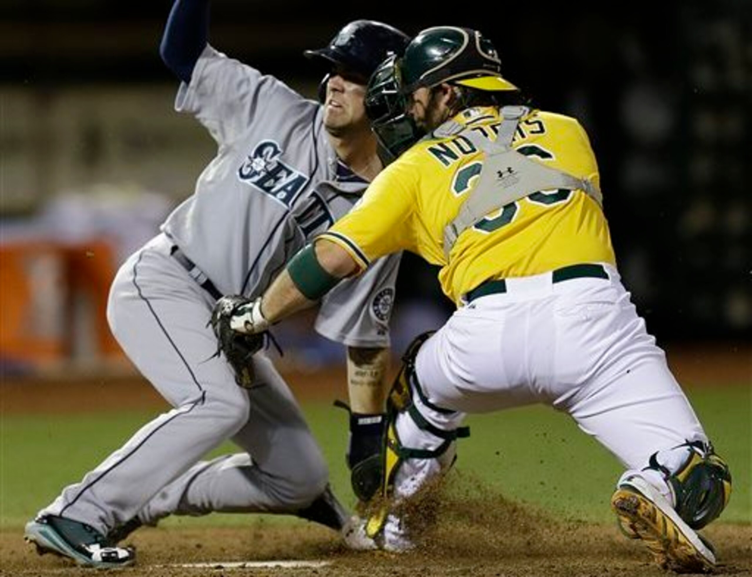 Norris makes a play at the plate.