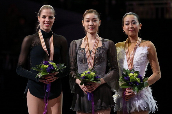 Carolina Kostner, Yuna Kim, and Mao Asada at the 2013 ISU World Figure Skating Championships.