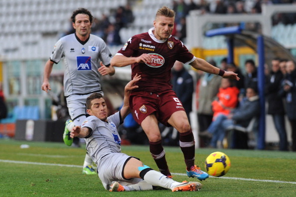 Ciro Immobile battles for loan club Torino against Atalanta.