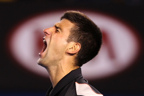 Novak Djokovic reacts to playing Stanislas Wawrinka at the 2014 Australian Open.