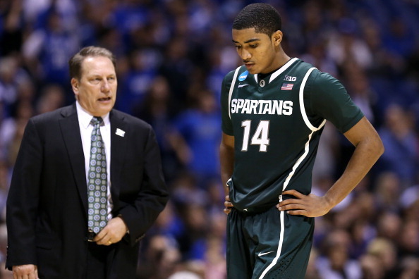 INDIANAPOLIS, IN - MARCH 29:  Gary Harris #14 of the Michigan State Spartans walks on court with his head down past head coach Tom Izzo in the second half against the Duke Blue Devils during the Midwest Region Semifinal round of the 2013 NCAA Men's Basket
