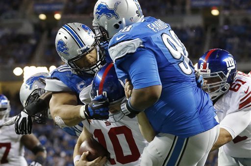 If you look closely, you will spot Eli Manning being swallowed by two giants.